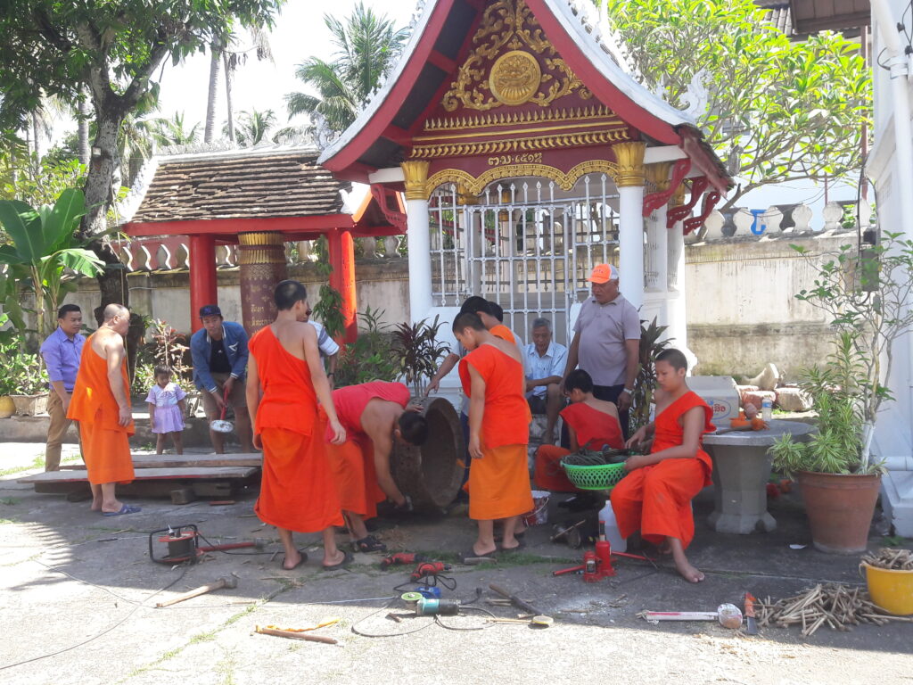 Monks repair a drum